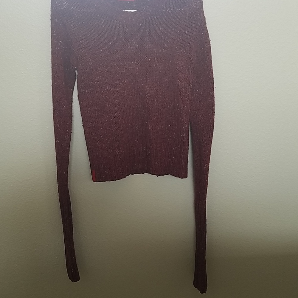 A red long sleeve sweater